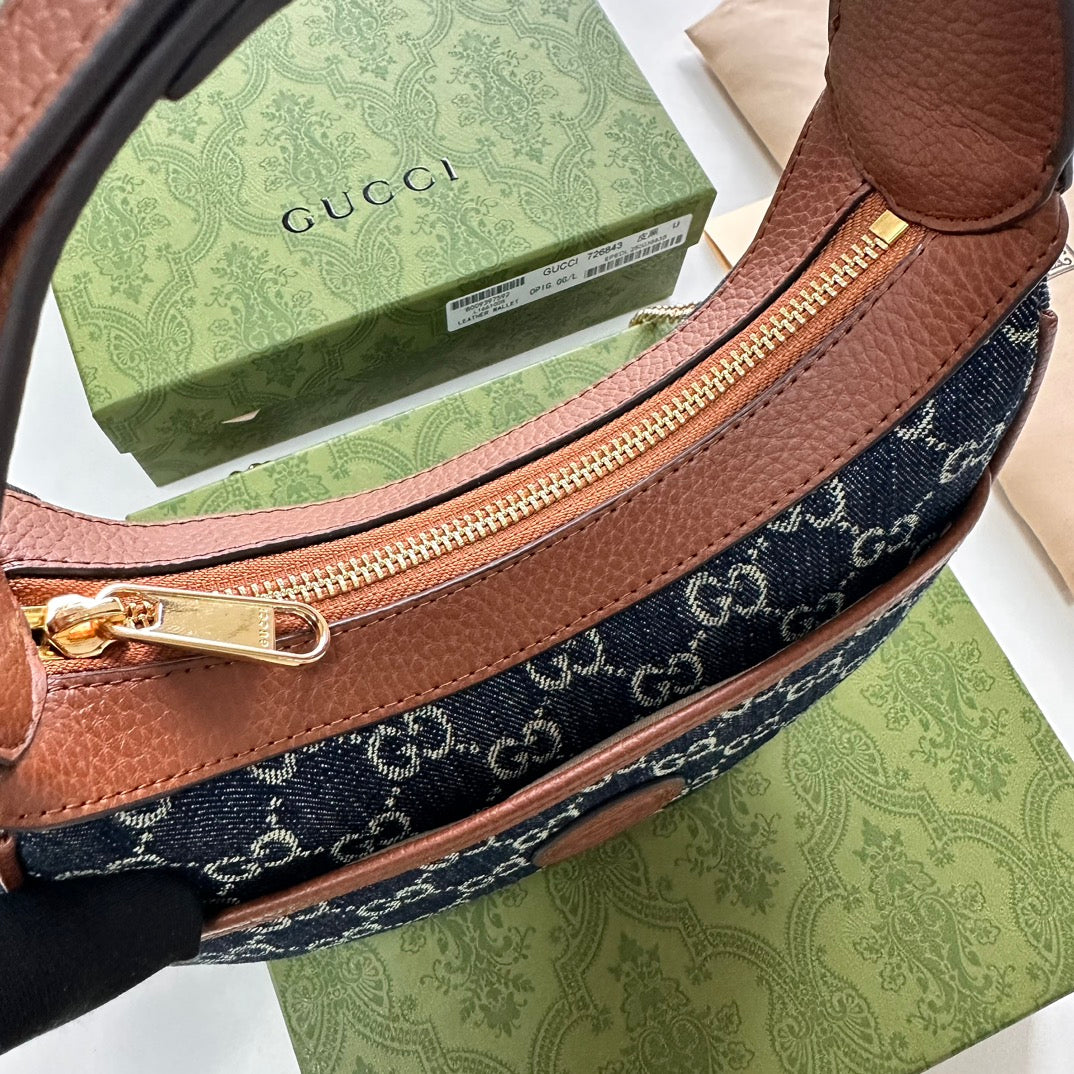 Gucci HALF-MOON-SHAPED MINI BAG WITH INTERLOCKING G