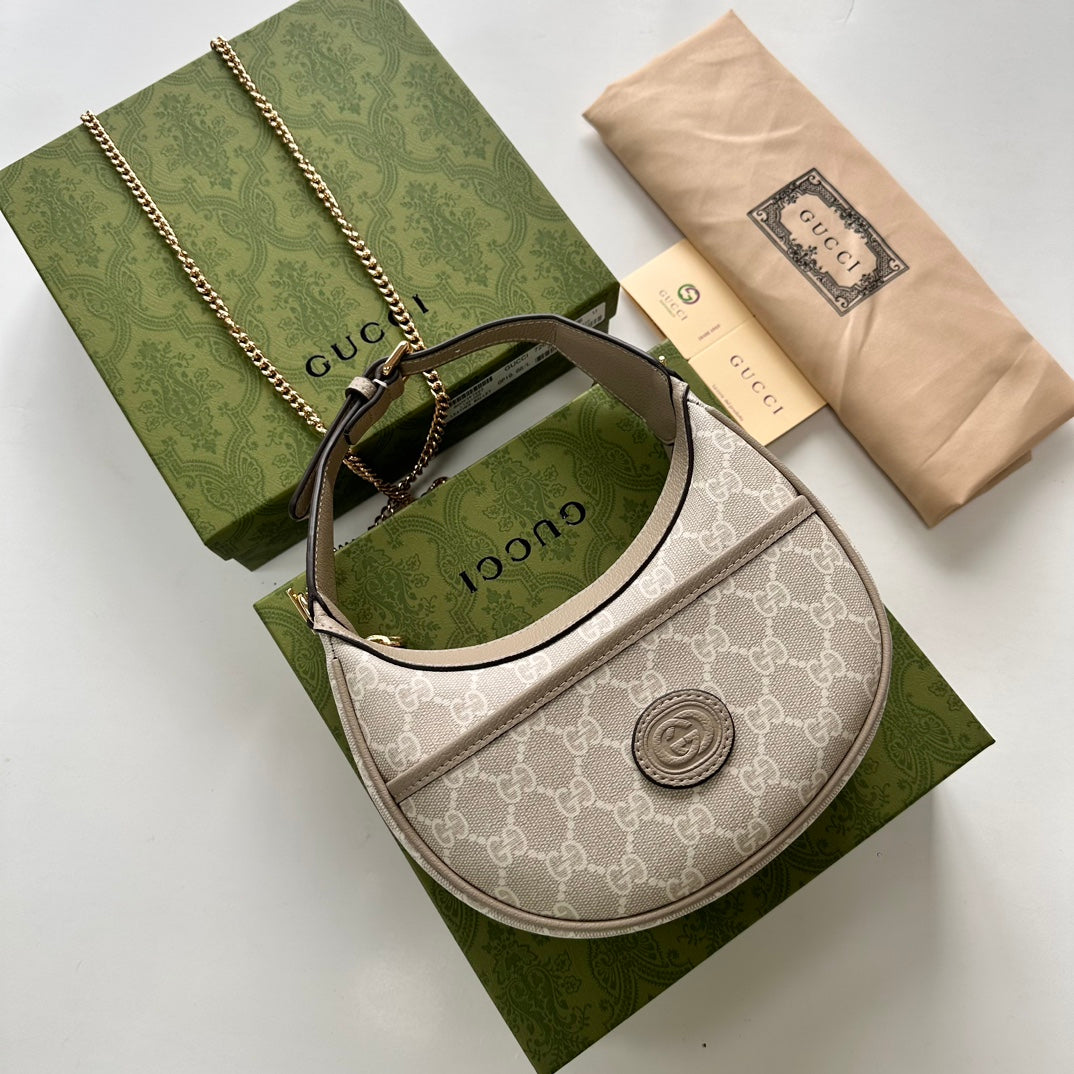 Gucci HALF-MOON-SHAPED MINI BAG WITH INTERLOCKING G