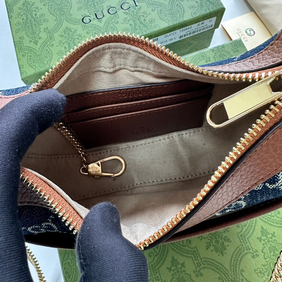 Gucci HALF-MOON-SHAPED MINI BAG WITH INTERLOCKING G